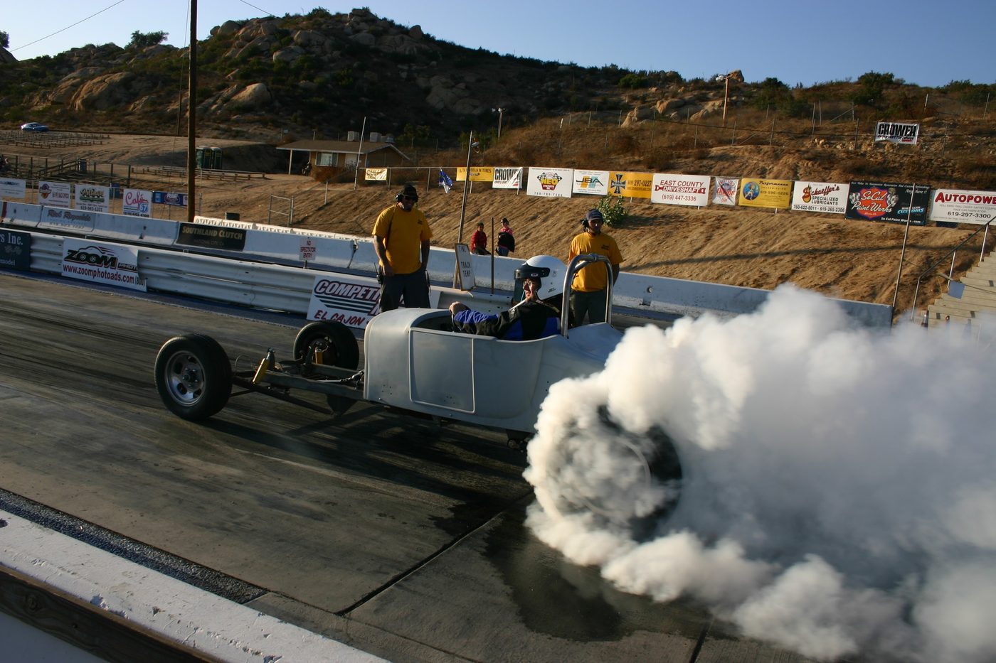 Electric car doing a smoky launch at the drag strip