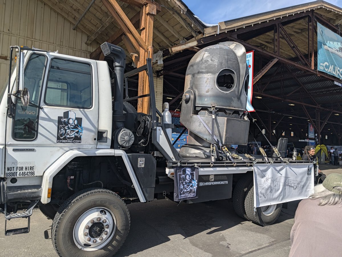 A giant robot built onto the back of a flatbed truck at Maker Faire